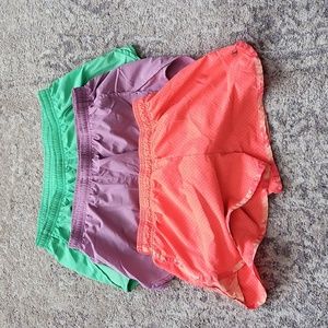 Nike dry fit running shorts (2 pair) and Champion gear shorts